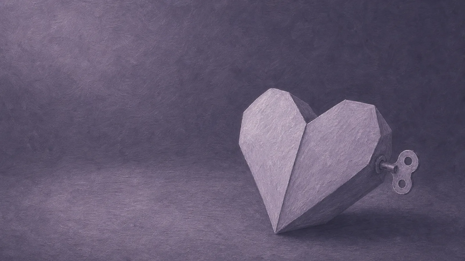 A paper heart with a small wind-up key set into its side