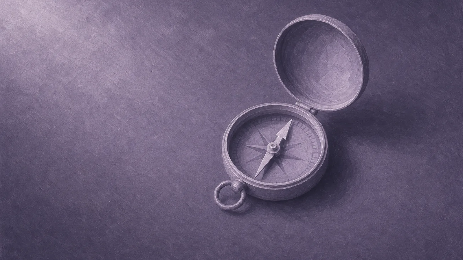 A small brass compass with a steady needle resting on dusty violet paper
