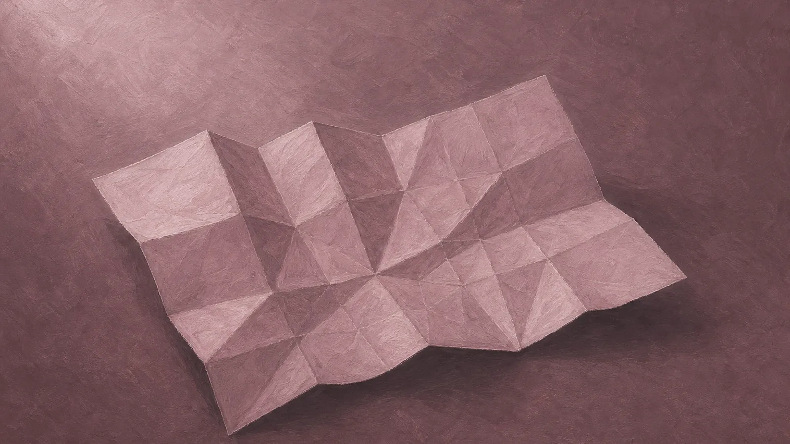 A single folded paper map lying open on a plain surface