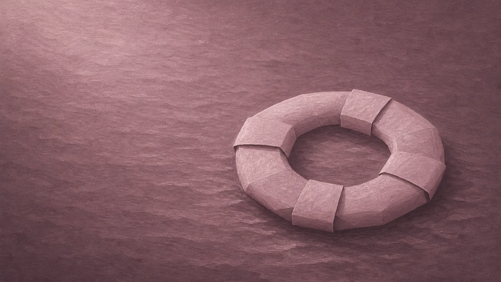 Ein Papier-Rettungsring, der in Reichweite auf ruhigem Papierwasser ruht