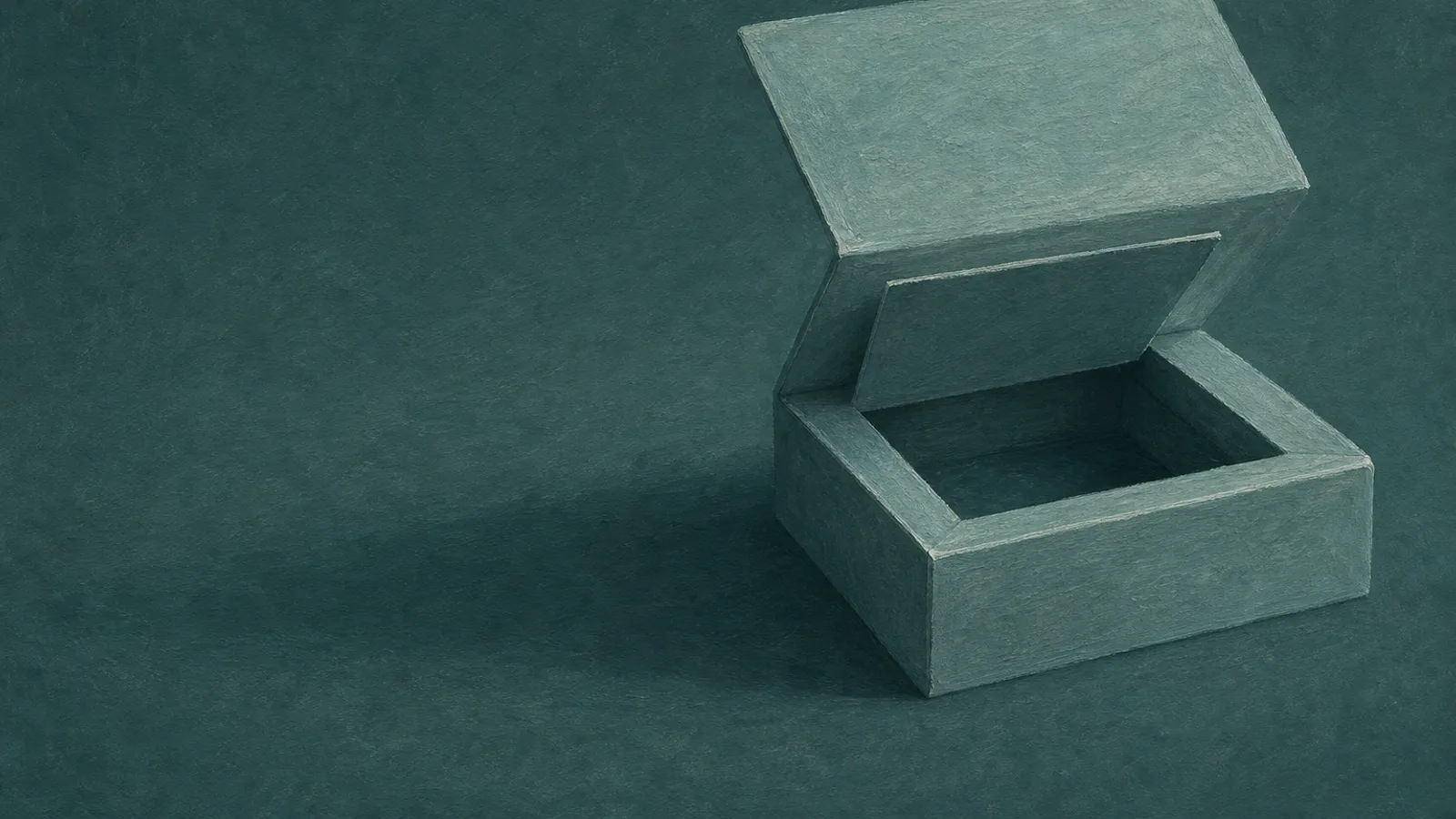 A folded-paper box with a false bottom lifted to reveal a hidden compartment beneath