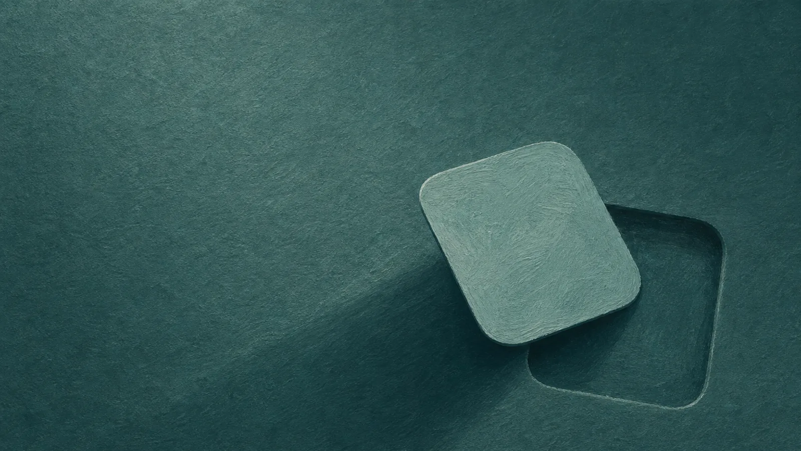 A folded-paper app icon lifted aside to show a shallow empty recess beneath it