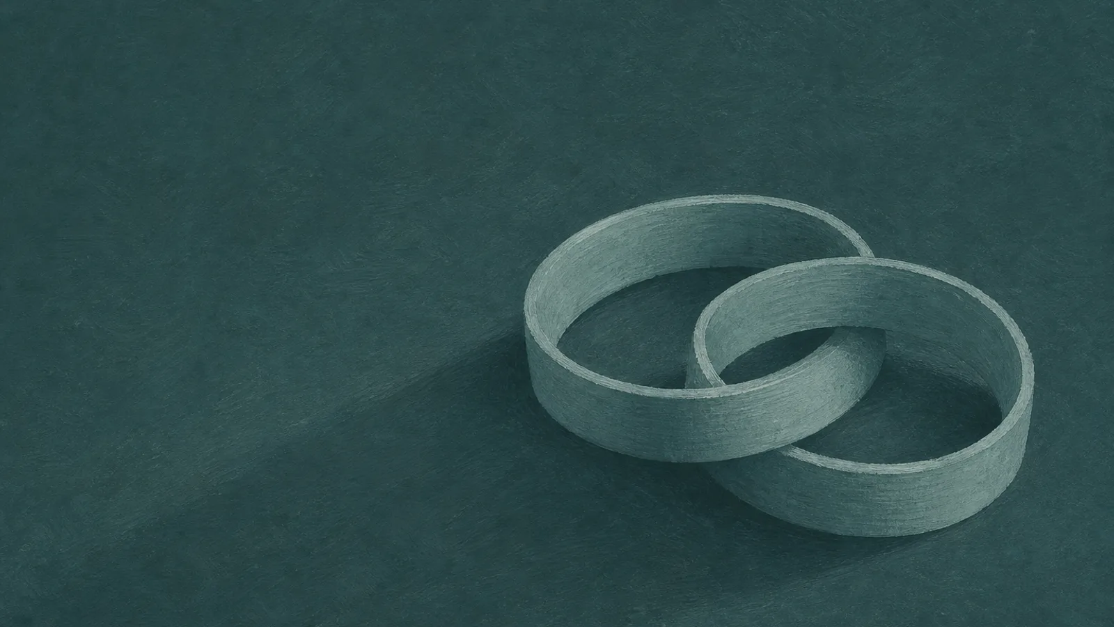 Two interlocking paper rings resting on a deep-teal surface, casting a single long shadow