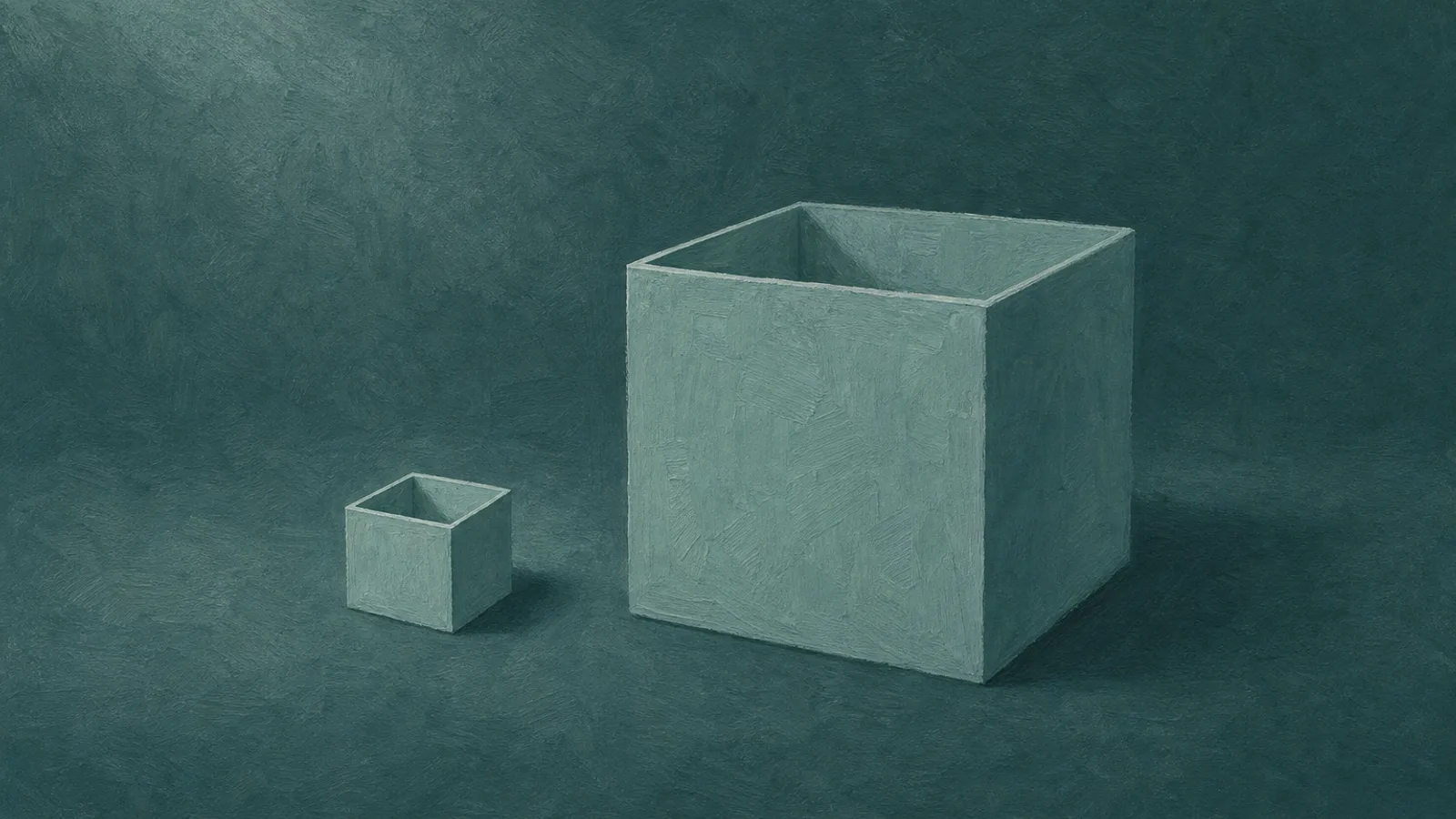 Two paper boxes, one small and one large, resting on a deep-teal surface