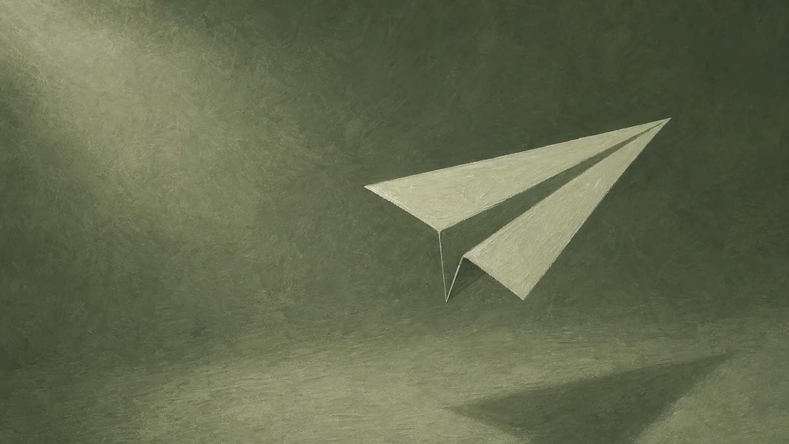 A folded paper plane caught in mid-flight above cream paper, released and beyond recall