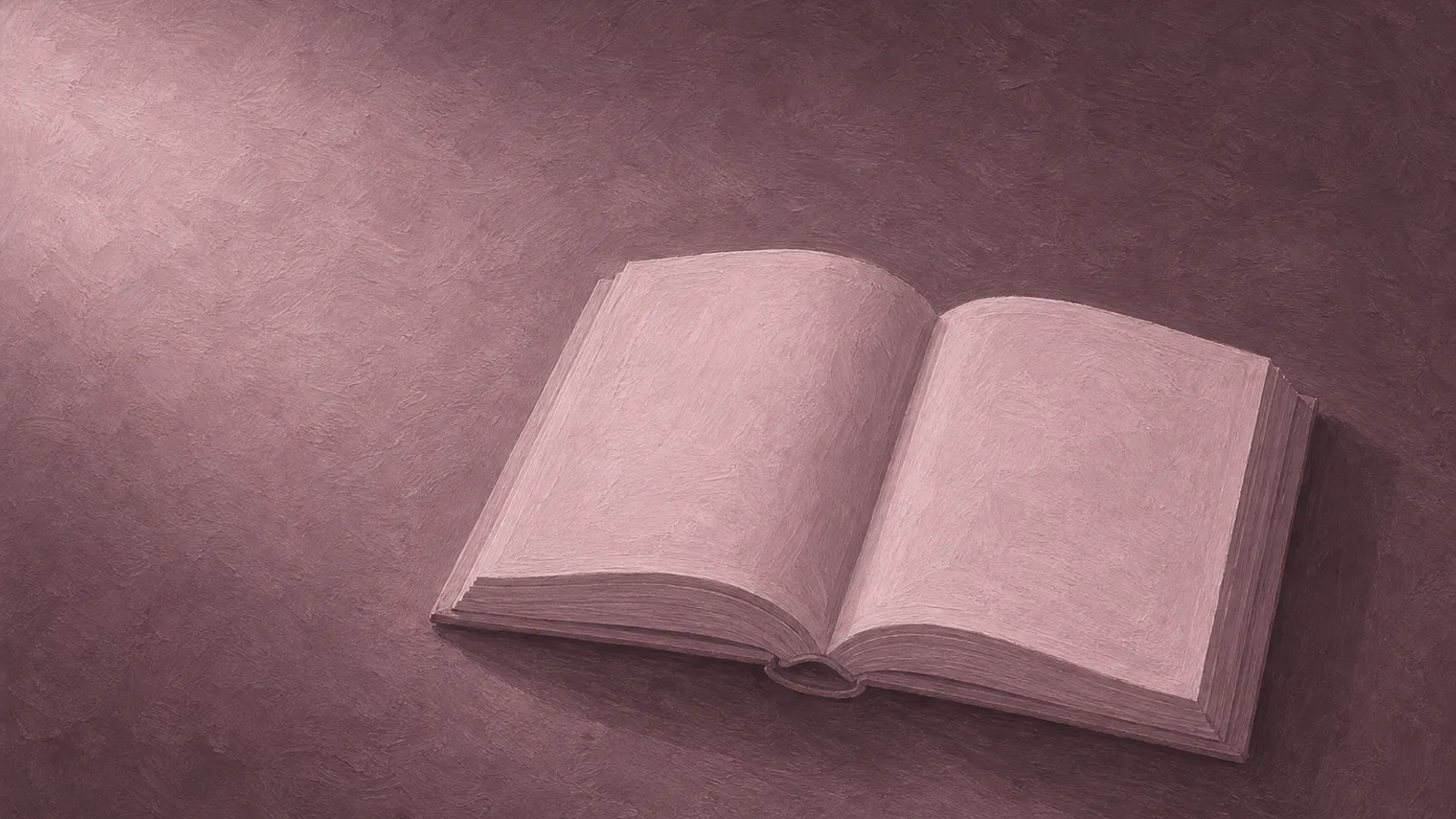 A single folded paper book lying open with blank pages on a plain surface