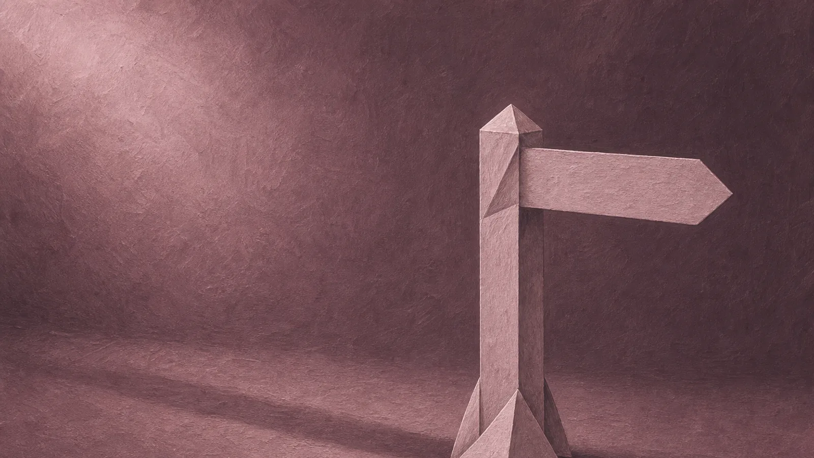 A single folded paper signpost on a plain surface, its arm pointing steadily in one direction