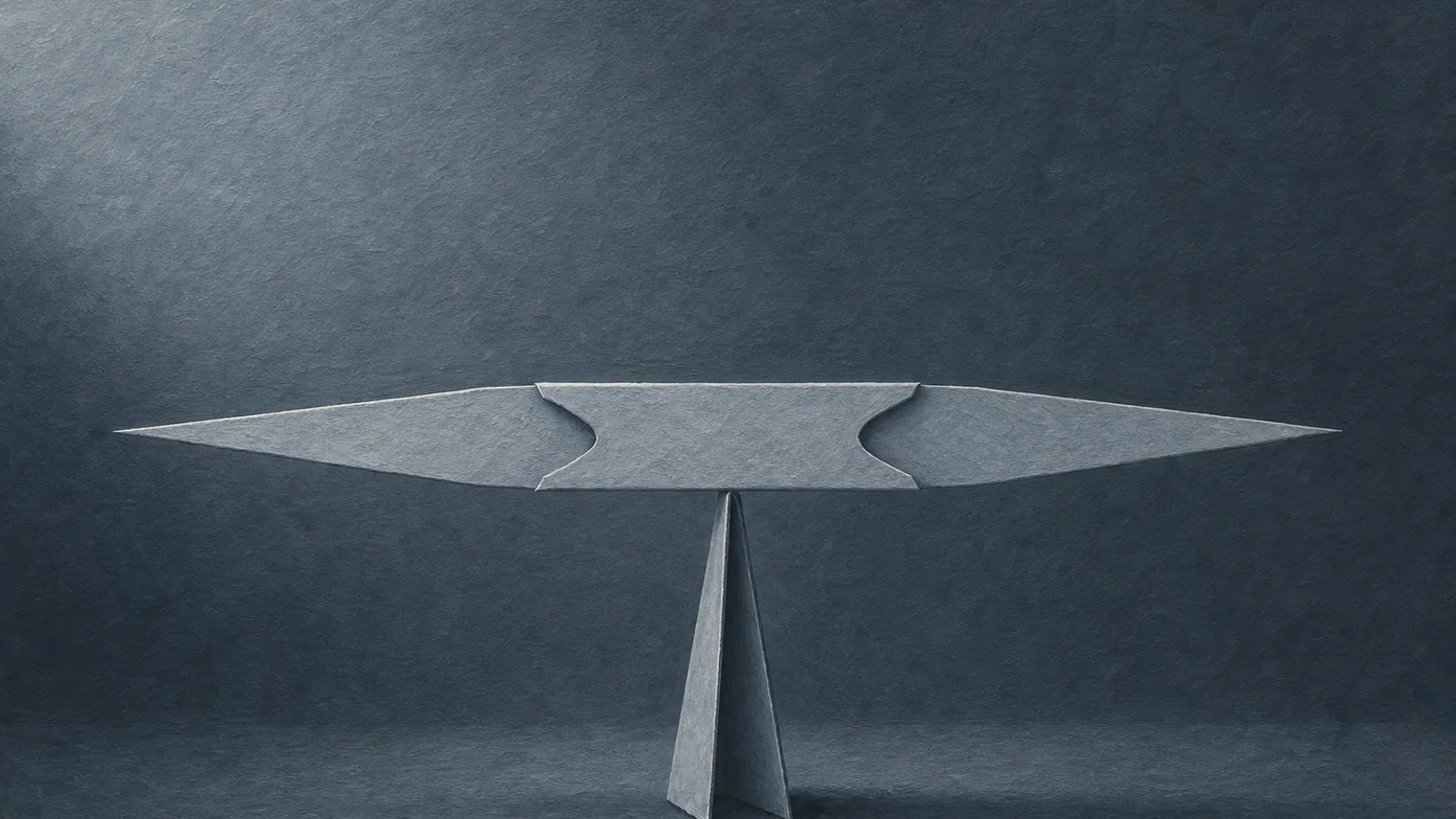 A folded paper double-edged knife balanced level on a slender paper stand, both edges facing outward